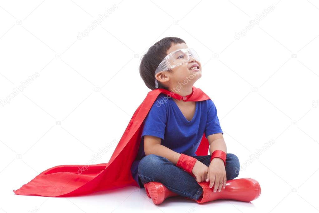 Little boy pretending to be a superhero