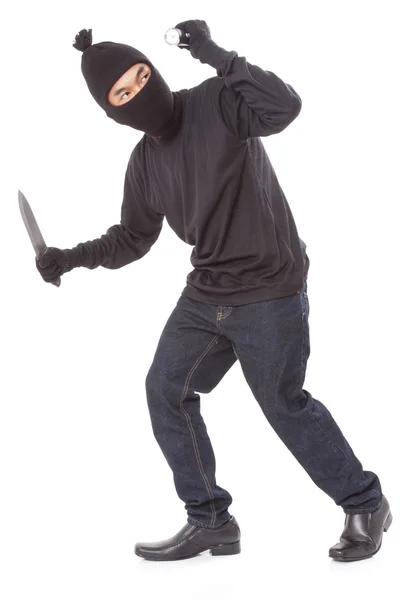 Homem com uma máscara segurando lanterna com uma faca — Fotografia de Stock