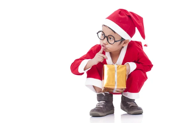 Chłopczyk na sobie mundur Mikołaj prezenty — Zdjęcie stockowe