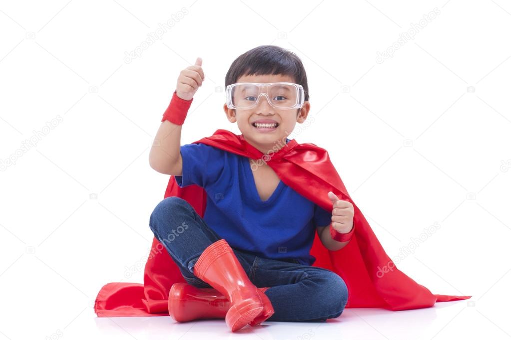 Little boy pretending to be a superhero