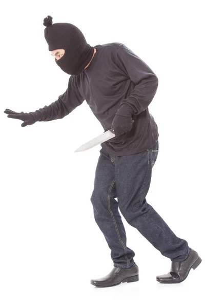 Man in a mask with a knife — Stock Photo, Image