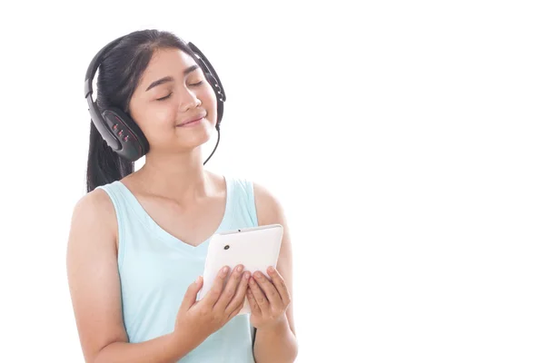 Jonge vrouwen met tablet pc en hoofdtelefoon. — Stockfoto