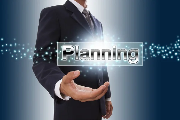 Businessman hand showing planning button on virtual screen. — Stock Photo, Image