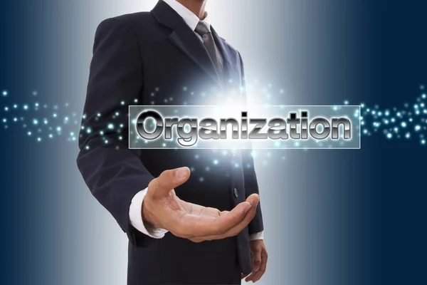 Businessman hand showing organization button on virtual screen. — Stock Photo, Image