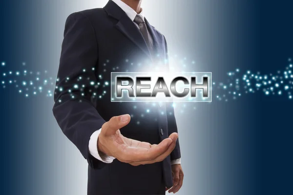 Businessman hand showing reach button on virtual screen. — Stock Photo, Image