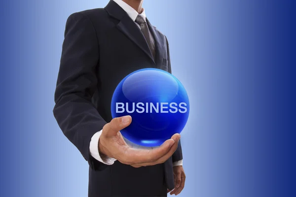 Businessman hand holding blue crystal ball with business word. — Stock Photo, Image