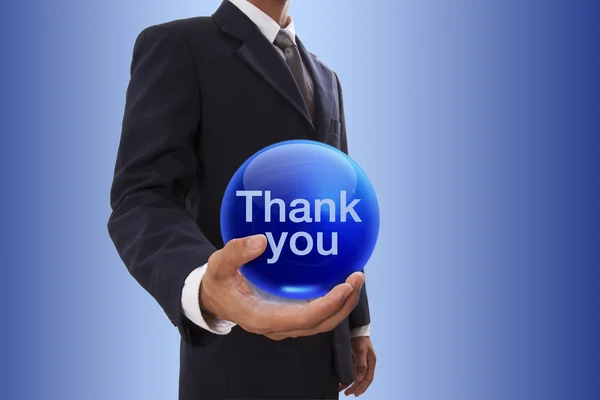 Επιχειρηματίας χέρι που κρατά την μπλε κρυστάλλινη σφαίρα με λέξη ευχαριστώ. — Φωτογραφία Αρχείου