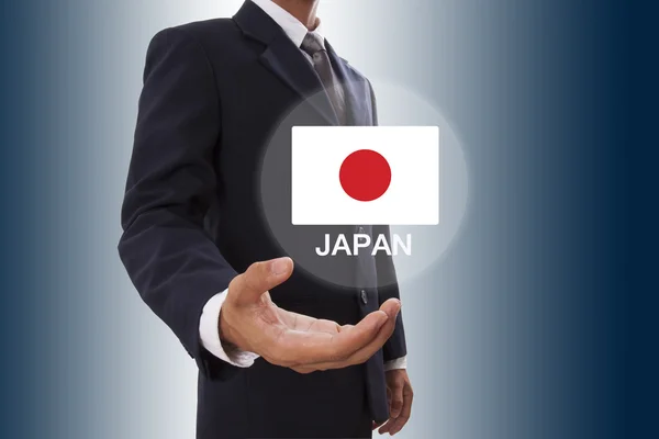 Empresario mano mostrando Bandera de Japón — Foto de Stock