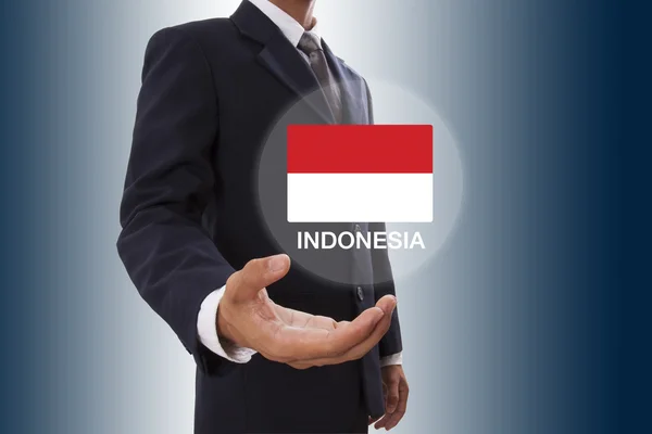 Affärsman hand visar Indonesien flagga — Stockfoto