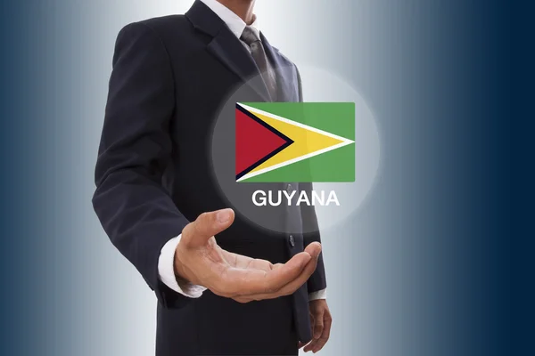 Uomo d'affari mano mostrando Bandiera Guyana — Foto Stock