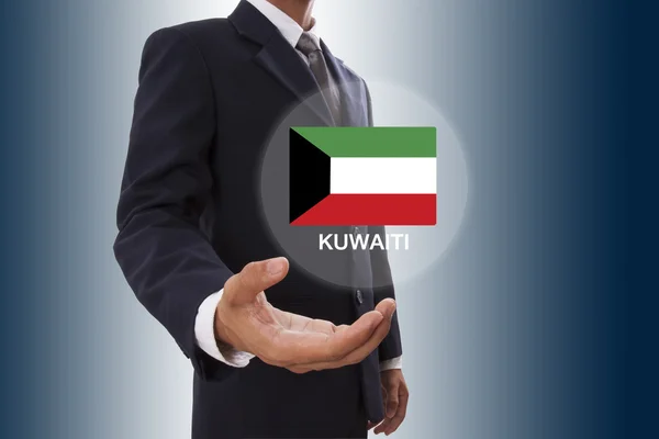 Businessman hand showing Kuwaiti Flag — Stock Photo, Image