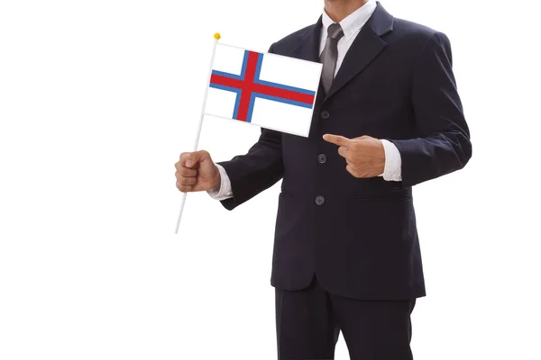 Businessman in suit holding Faroe Islands Flag — Stock Photo, Image