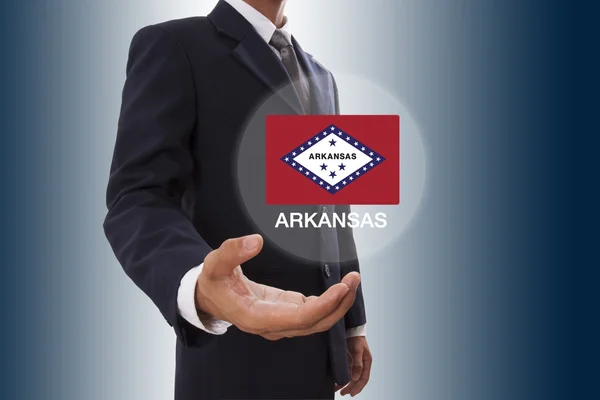 Uomo d'affari mano mostrando Arkansas Bandiera — Foto Stock