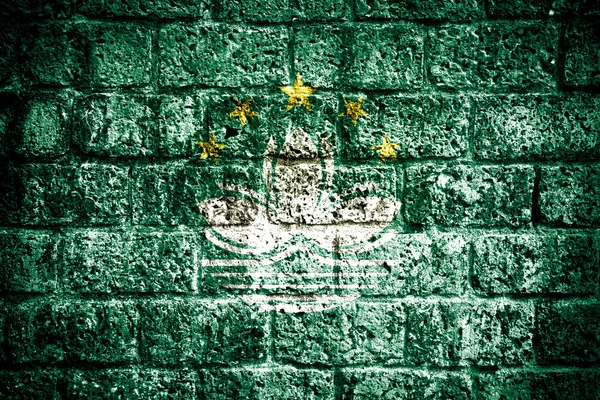 Bandeira de Macau pintada na parede de tijolos — Fotografia de Stock