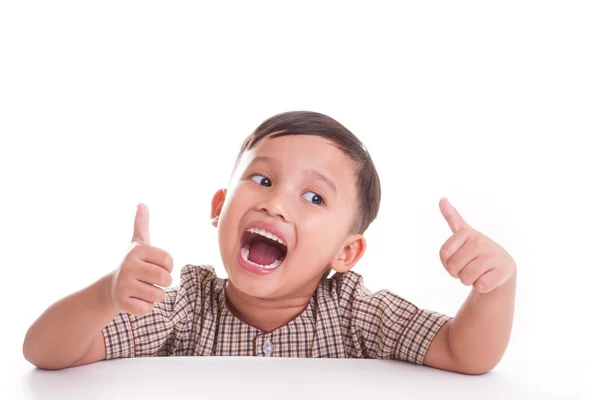 Boy showing thumbs up gesture — Stock Photo, Image