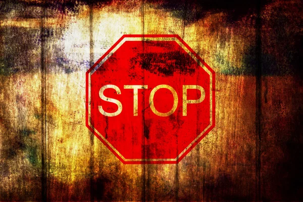 Stop sign on grunge wood background — Stock Photo, Image