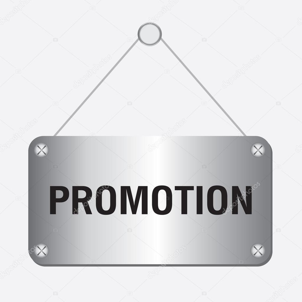 Silver metallic promotion sign hanging on the wall