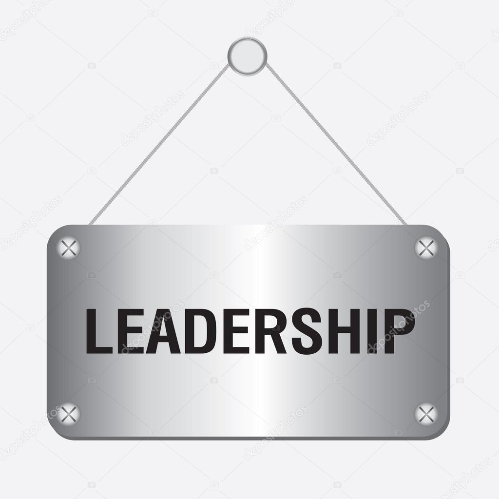 Silver metallic leadership sign hanging on the wall