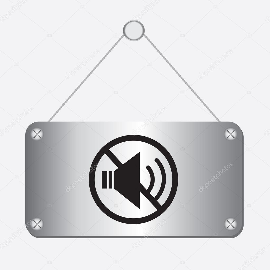 Silver metallic no sound sign hanging on the wall