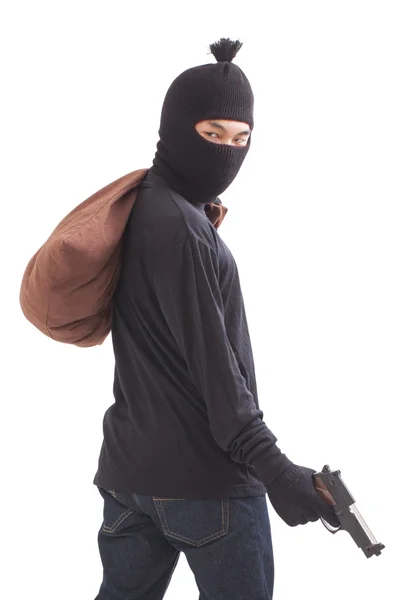 Bandit holding gun with bag on white background — Stock Photo, Image