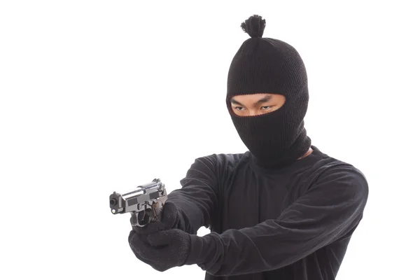 Man in a mask with a gun on a white background — Stock Photo, Image