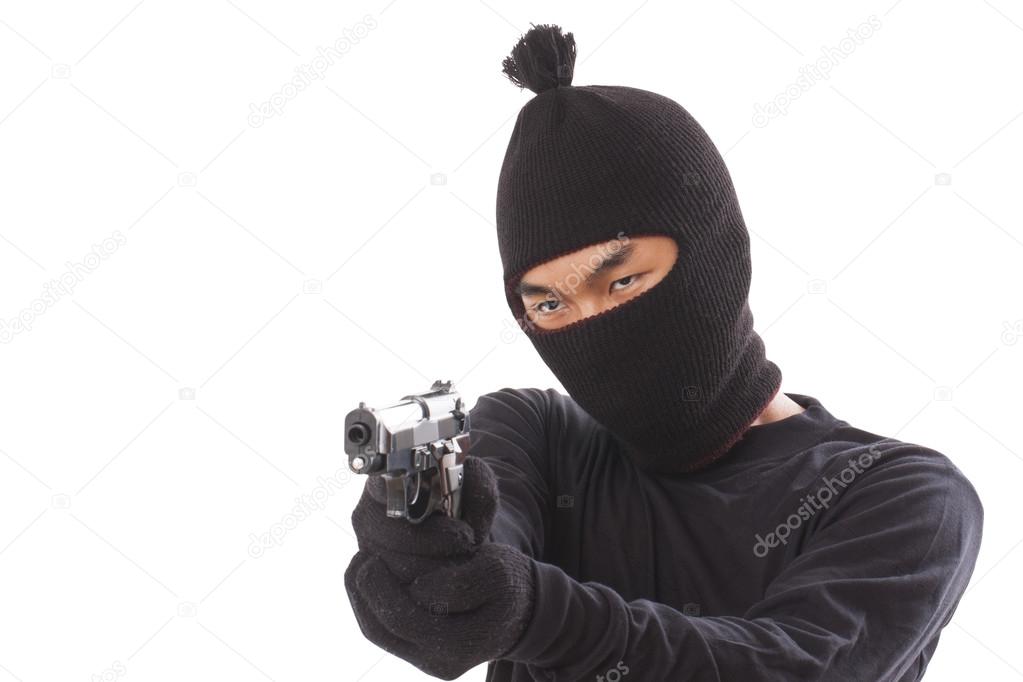 Man in a mask with a gun on a white background