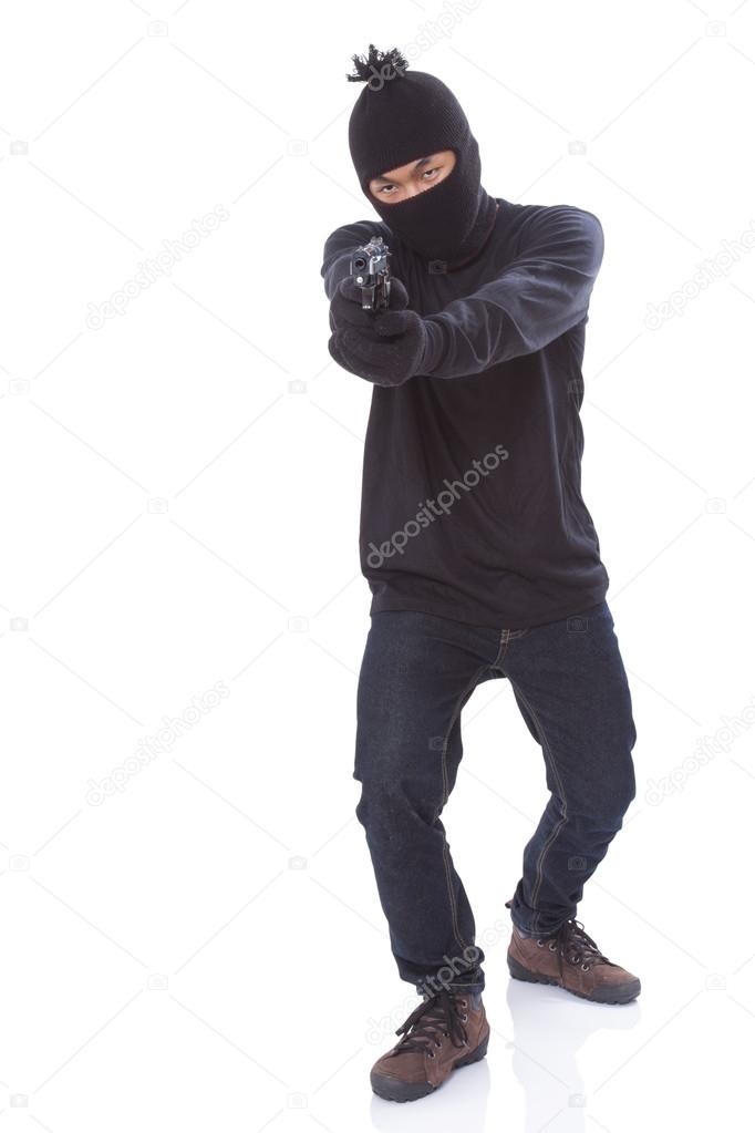 Man in a mask with a gun on a white background