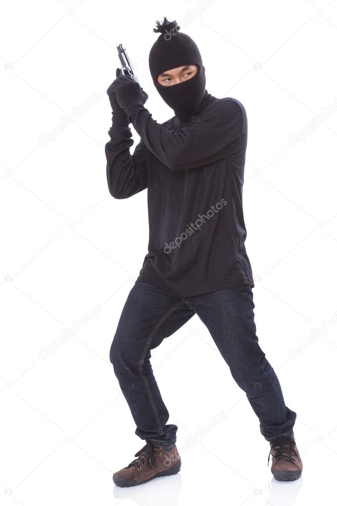 Man in a mask with a gun on a white background