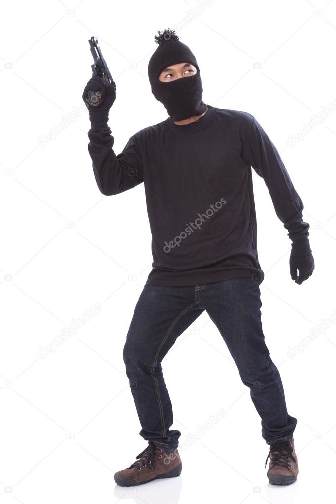 Man in a mask with a gun on a white background