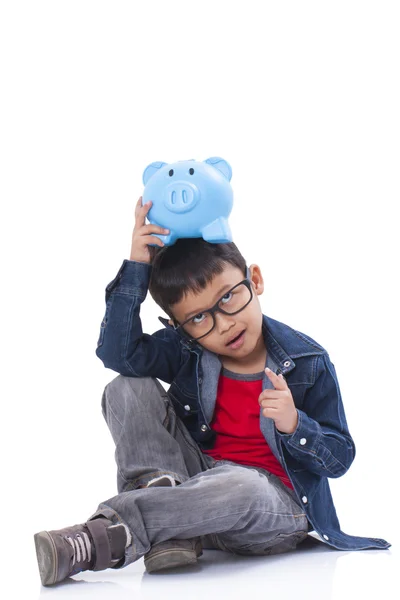 Little boy with piggy bank — Stock Photo, Image