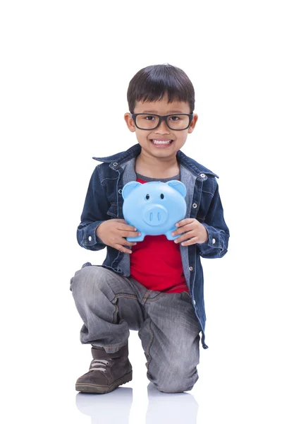 Little boy with piggy bank — Stock Photo, Image