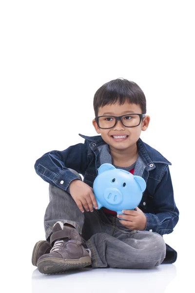 Little boy with piggy bank — Stock Photo, Image