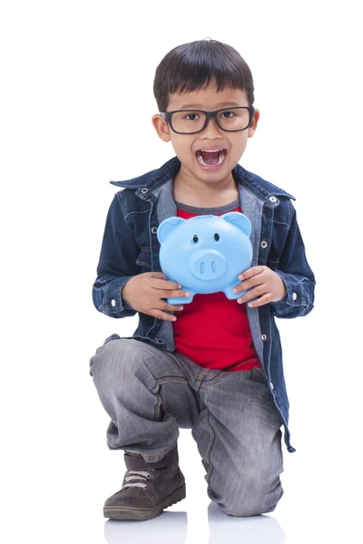 Little boy with piggy bank — Stock Photo, Image