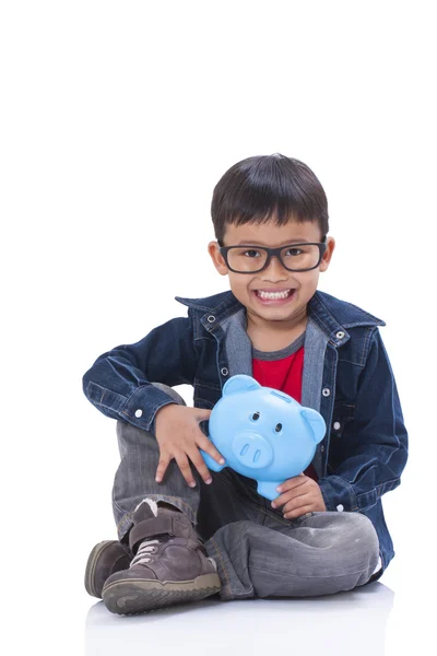 Little boy with piggy bank — Stock Photo, Image