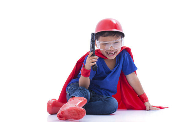 Child pretending to be a superhero with toy gun on white background