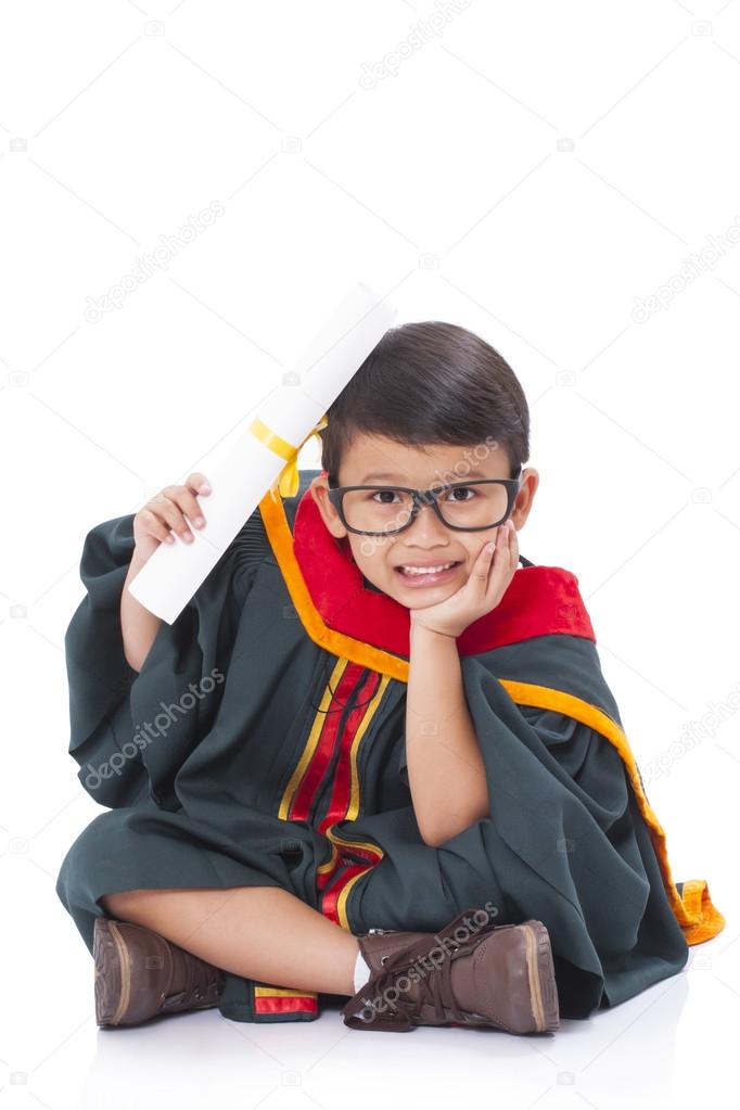 Happy boy in graduation suit.