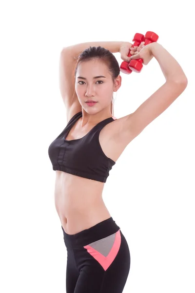 Спортивная женщина делает упражнения с поднятием тяжестей — стоковое фото