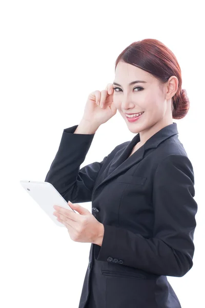 Portrait of young business woman using tablet and thinking — Stock Photo, Image