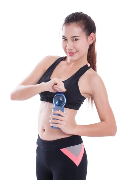 Sportovní mladá žena s lahví vody na bílém pozadí — Stock fotografie