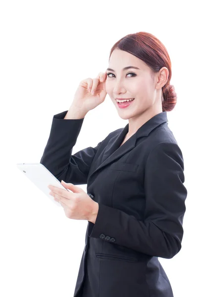 Portrait of young business woman using tablet and thinking. — Stock Photo, Image