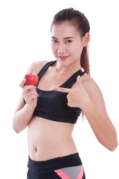 Mujer fitness sosteniendo manzana sobre fondo blanco. concepto saludable —  Fotos de Stock