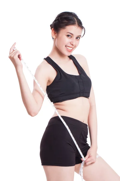 Fitness young woman taking measurements of her body. healthy concept — Stock Photo, Image