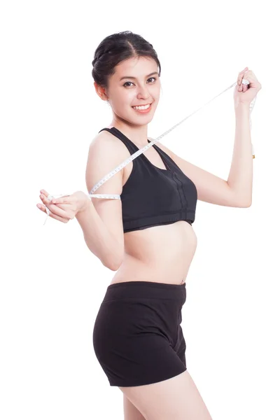 Młoda dama fitness pomiar jej ciała. pojęcie zdrowego — Zdjęcie stockowe
