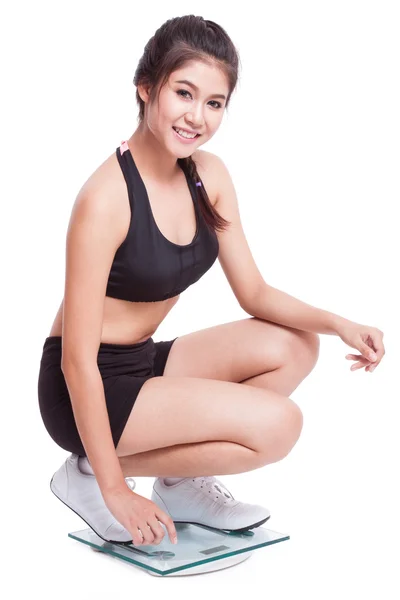 Fitness woman on scales — Stock Photo, Image