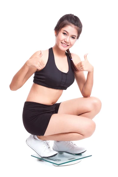 Fitness vrouw op schalen — Stockfoto