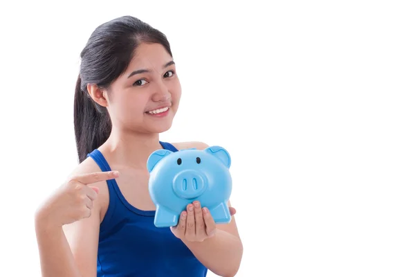 Happy young woman holding piggy bank isolated on white background — Stock Photo, Image