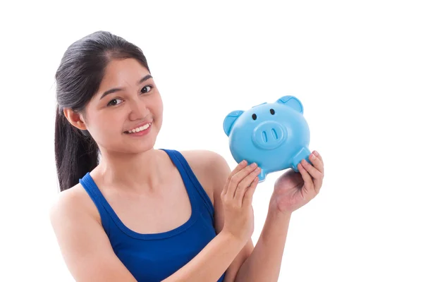 Happy young woman holding piggy bank isolated on white background — Stock Photo, Image