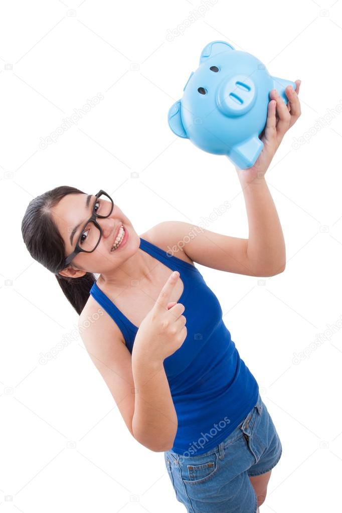 Happy young woman holding piggy bank isolated on white background