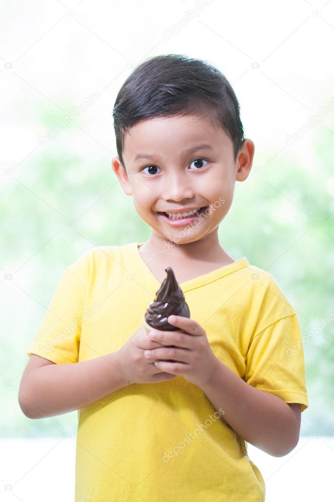 asian boy eating ice-cream.