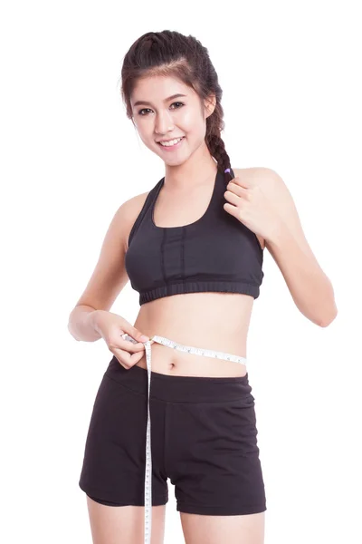 Fitness junge Frau mit Maßband — Stockfoto